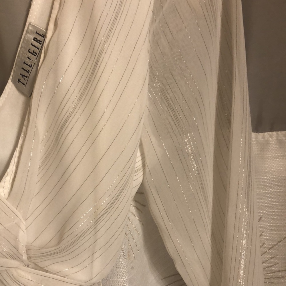 White and shimmery silver blouse with low v-neck. - Picture 2 of 3